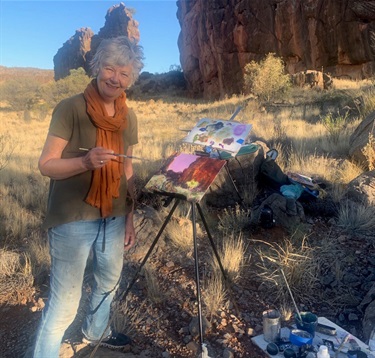 Debbie Mackinnon painting en plein air, East Macdonnell Ranges, Northern Territory