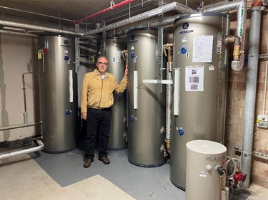 Brian Peck with hot water tanks