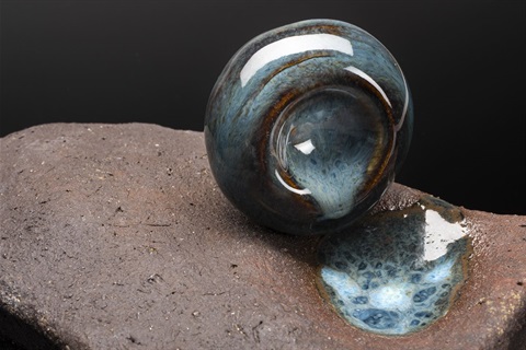 Korina-Konopka-Waters-mark-2023-Wheel-thrown-glazed-droplet-pouring-over-the-rock_THUMB.jpg